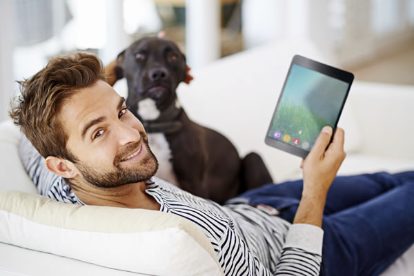 Man connected to internet on wireless tablet